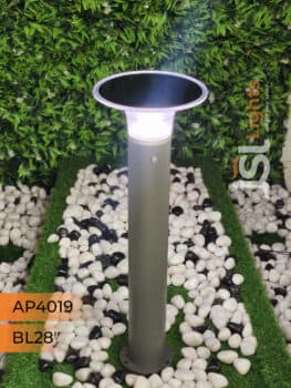 Garden path lit by outdoor bollard lights at dusk